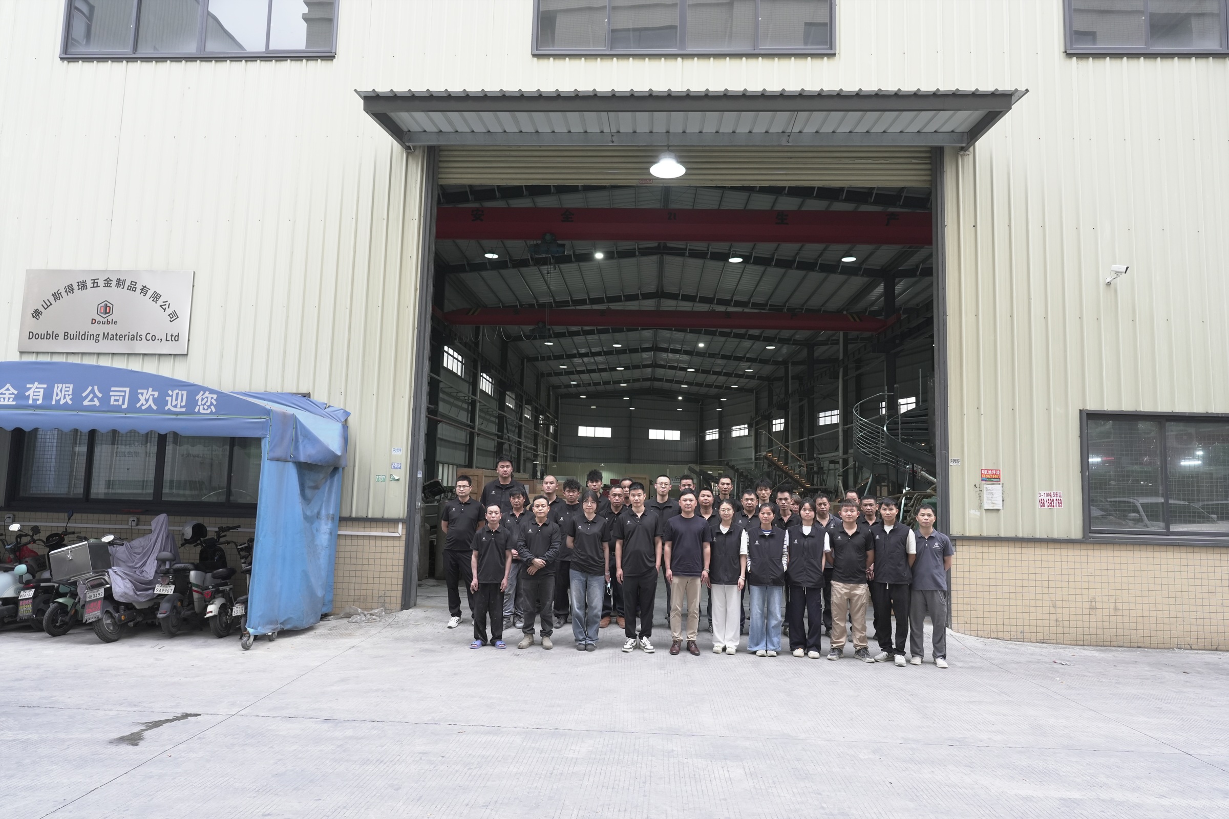 Double Building Materials factory team at the Guangdong workshop entrance