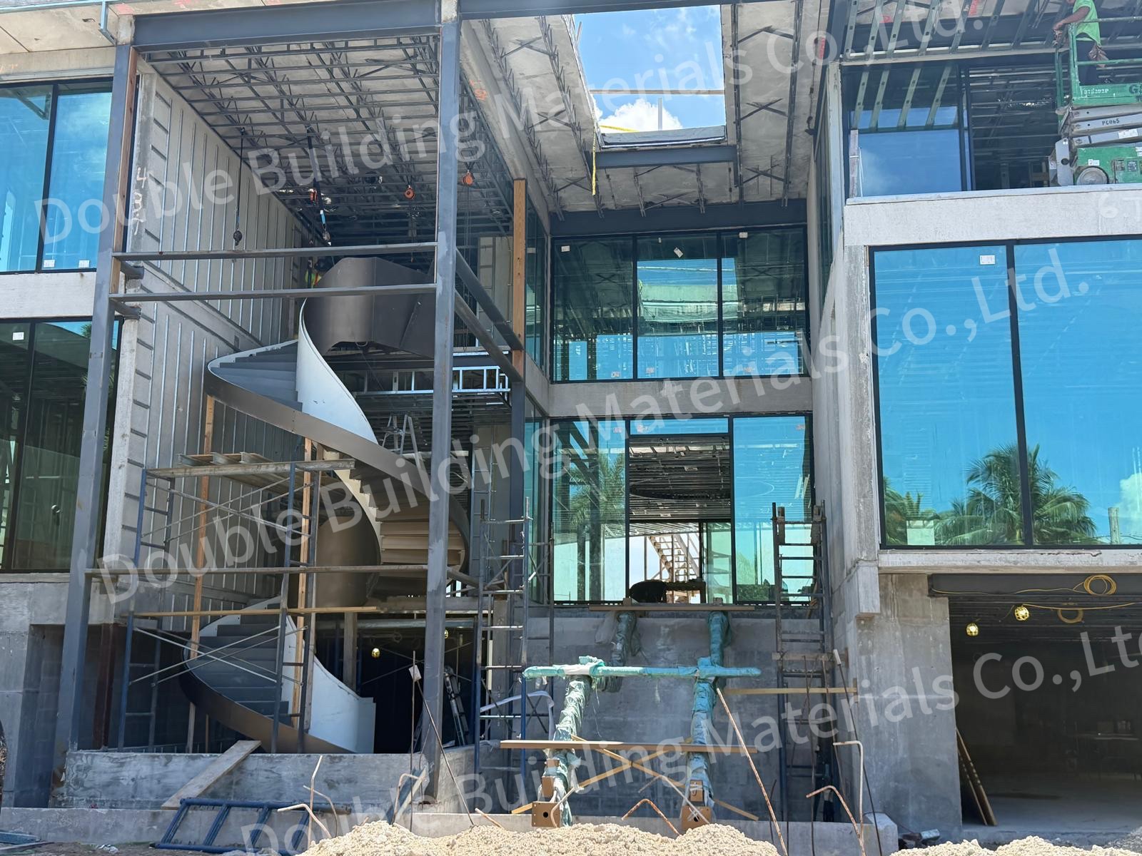 Curved staircase with its inner and outer stringers standing in an unfinished building during construction, Miami